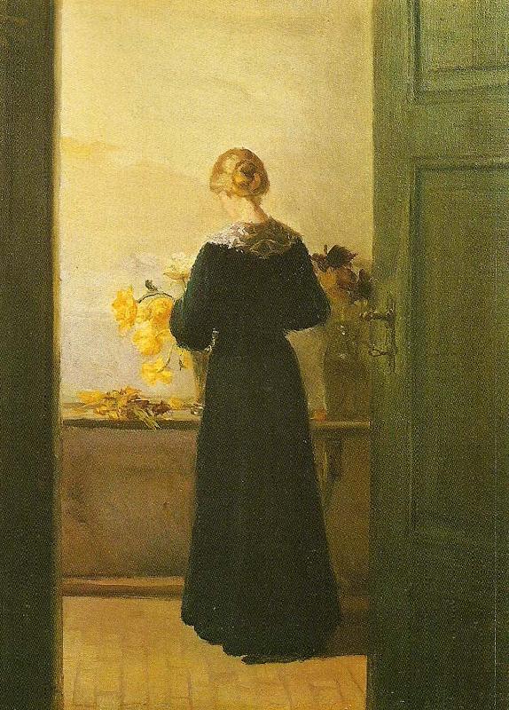 Anna Ancher en ung pige ordner blomster Sweden oil painting art